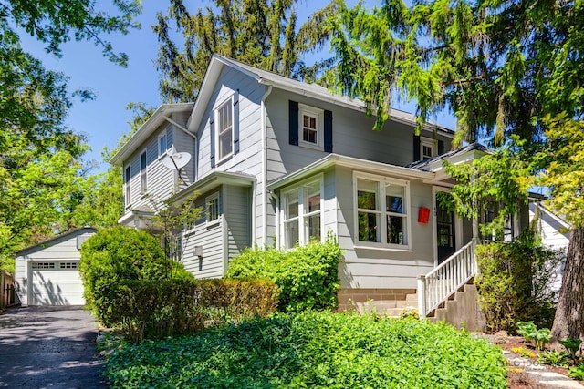 40 Washington Rd, Lake Forest, IL 60045 - view of front of home with an outdoor structure, a detached garage, and stairway
