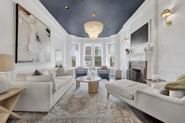 1814 N Lincoln Park W Unit 3, Chicago, IL 60614 - living room featuring a decorative wall, a fireplace, ornamental molding, wood finished floors, and wainscoting