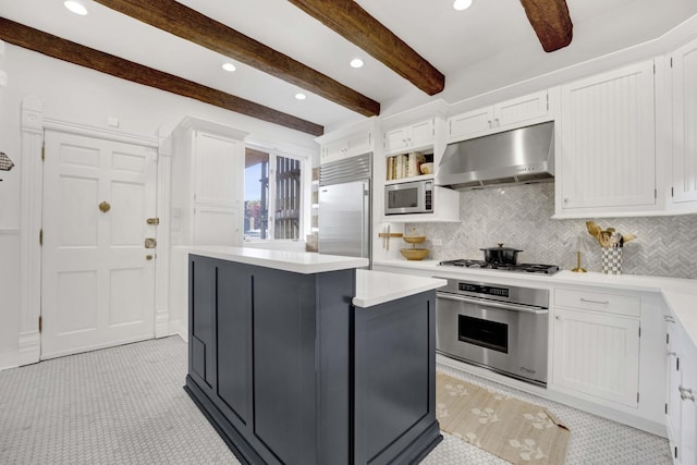 1814 N Lincoln Park W Unit 3, Chicago, IL 60614 - kitchen with built in appliances, under cabinet range hood, white cabinetry, light countertops, and beamed ceiling