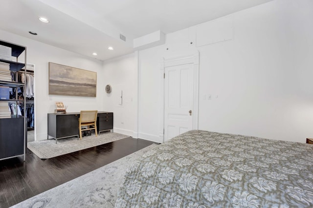 1814 N Lincoln Park W Unit 3, Chicago, IL 60614 - bedroom with dark wood-style flooring, recessed lighting, a walk in closet, baseboards, and a closet