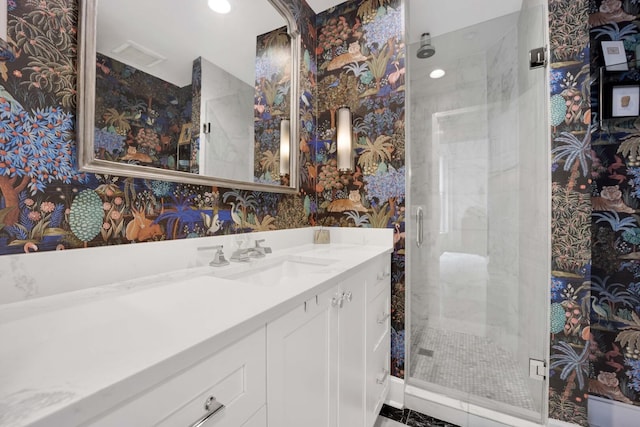 1814 N Lincoln Park W Unit 3, Chicago, IL 60614 - bathroom featuring vanity, a stall shower, recessed lighting, and wallpapered walls