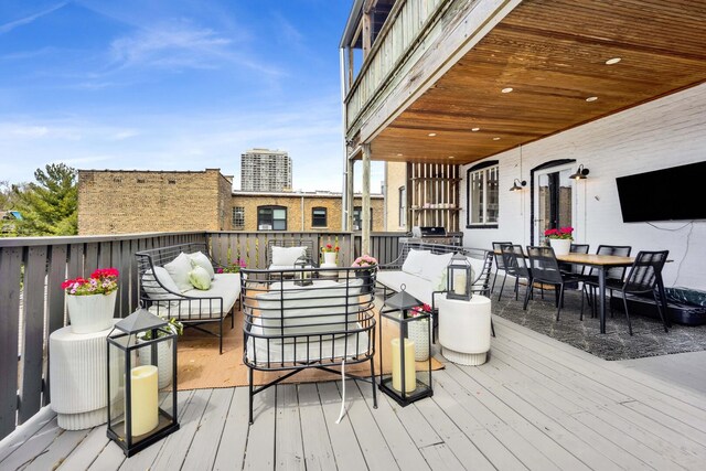 1814 N Lincoln Park W Unit 3, Chicago, IL 60614 - wooden deck featuring an outdoor living space and outdoor dining area