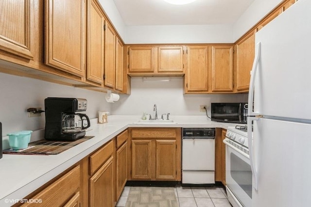 941 N NW Hwy Unit 1A, Park Ridge, IL 60068 - kitchen with white appliances, a sink, light countertops, and brown cabinetry