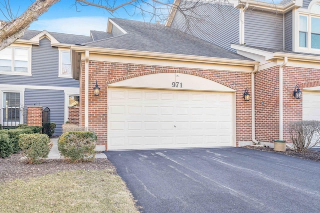 971 Heathrow Ln, Naperville, IL 60540 - view of side of property with brick siding, driveway, roof with shingles, and a garage
