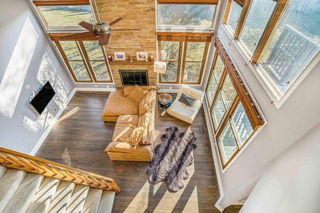 971 Heathrow Ln, Naperville, IL 60540 - living area with a high ceiling, plenty of natural light, ceiling fan, a fireplace, and wood finished floors