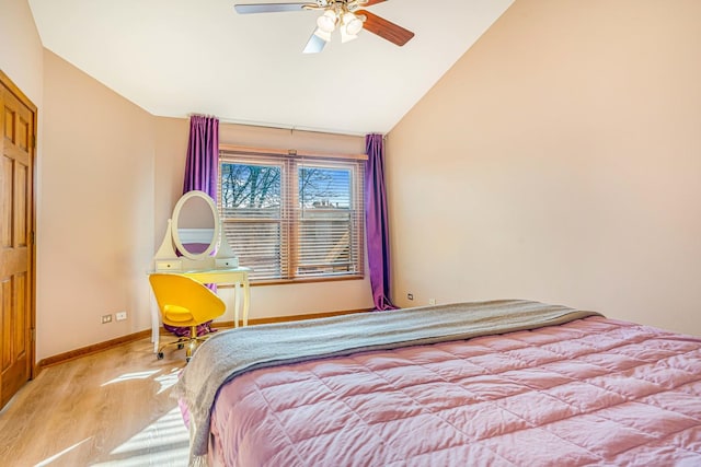 971 Heathrow Ln, Naperville, IL 60540 - bedroom featuring wood finished floors, vaulted ceiling, baseboards, and a ceiling fan
