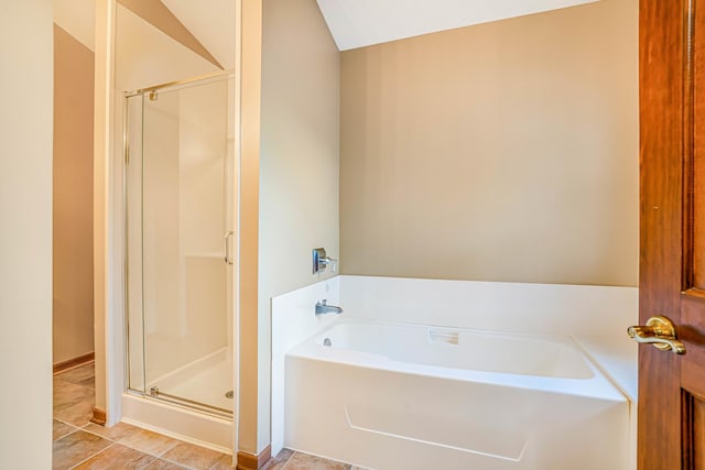 971 Heathrow Ln, Naperville, IL 60540 - full bathroom featuring a shower stall, a bath, vaulted ceiling, baseboards, and tile patterned flooring