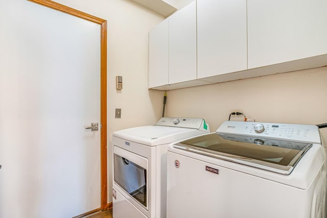 971 Heathrow Ln, Naperville, IL 60540 - laundry area with cabinet space and washing machine and clothes dryer