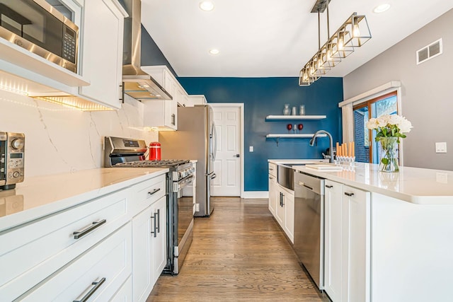 971 Heathrow Ln, Naperville, IL 60540 - kitchen featuring appliances with stainless steel finishes, wall chimney range hood, open shelves, white cabinets, and light wood-type flooring