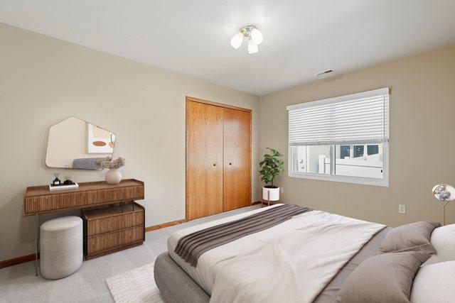 1622 Evergreen Ave, Crown Point, IN 46307 - bedroom featuring baseboards, a closet, and carpet floors