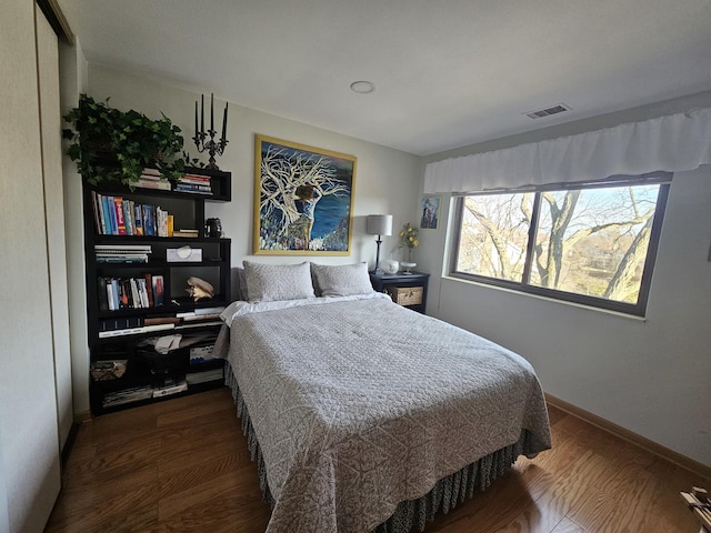 3110 Pheasant Creek Dr Unit 304, Northbrook, IL 60062 - bedroom with dark wood-type flooring and baseboards
