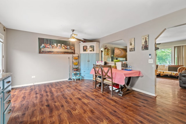 411 N Crestwood Ave, Mchenry, IL 60051 - dining room featuring ceiling fan, baseboards, dark wood finished floors, and arched walkways