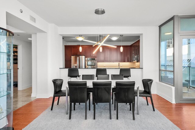 600 N Lake Shore Dr Unit 1105, Chicago, IL 60611 - dining room with light wood-style flooring and baseboards