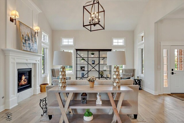 8806 Indiana Harbor Dr, Frankfort, IL 60423 - dining space with light wood-type flooring, plenty of natural light, and a premium fireplace