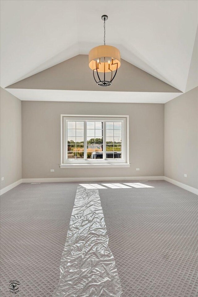 8806 Indiana Harbor Dr, Frankfort, IL 60423 - carpeted spare room with vaulted ceiling, a chandelier, and baseboards