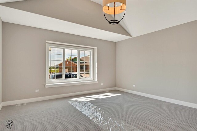 8806 Indiana Harbor Dr, Frankfort, IL 60423 - empty room featuring carpet floors, vaulted ceiling, and baseboards