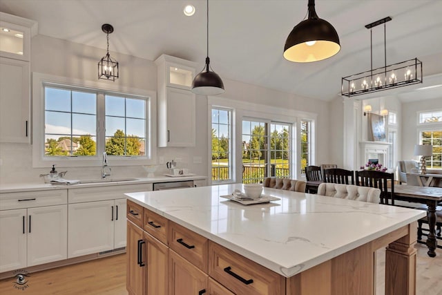 8806 Indiana Harbor Dr, Frankfort, IL 60423 - kitchen featuring a sink, light wood-style flooring, tasteful backsplash, light stone counters, and recessed lighting