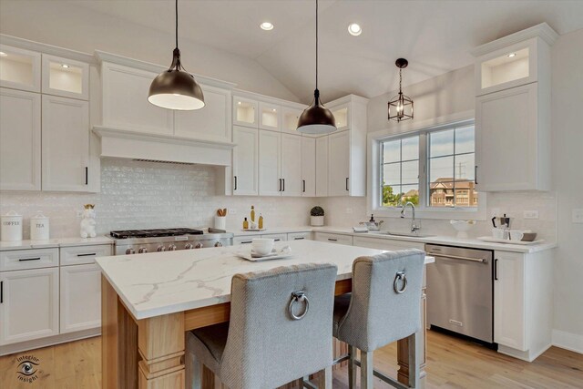 8806 Indiana Harbor Dr, Frankfort, IL 60423 - kitchen with dishwasher, a sink, light wood finished floors, white cabinets, and recessed lighting