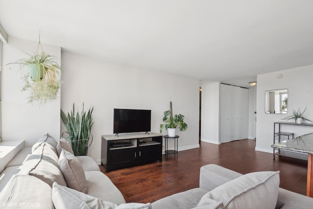 living room with wood finished floors and baseboards