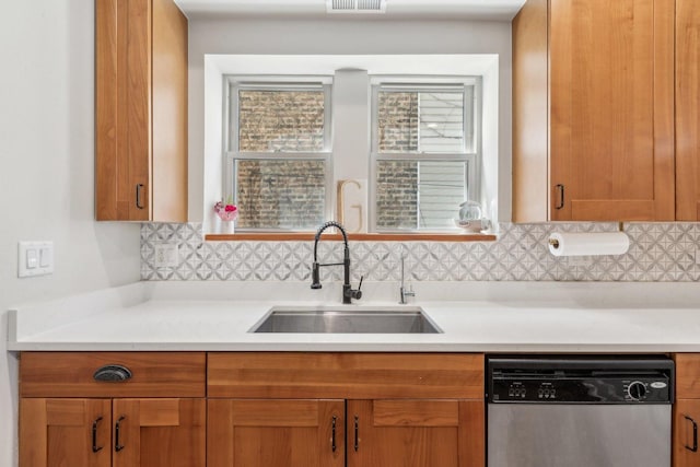 5140 N Albany Ave Unit 1, Chicago, IL 60625 - kitchen featuring dishwasher, a sink, backsplash, and light countertops