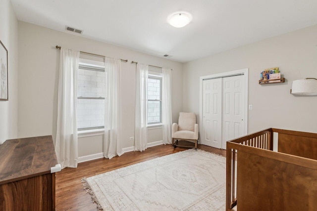 5140 N Albany Ave Unit 1, Chicago, IL 60625 - bedroom featuring wood finished floors, a closet, and baseboards