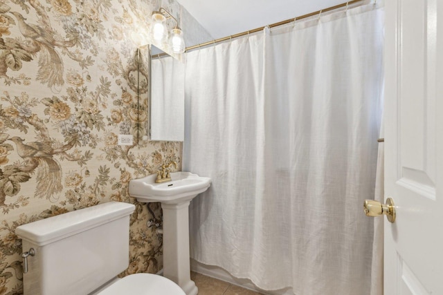 5140 N Albany Ave Unit 1, Chicago, IL 60625 - bathroom with toilet, wallpapered walls, tile patterned flooring, and curtained shower