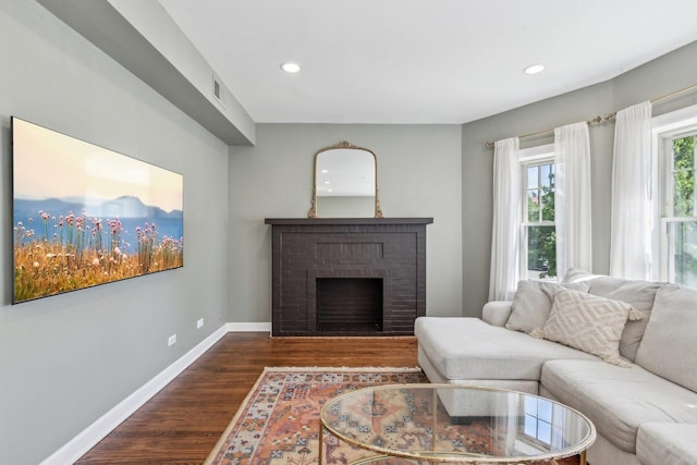 5140 N Albany Ave Unit 1, Chicago, IL 60625 - living room featuring dark wood-style floors, recessed lighting, baseboards, and a fireplace