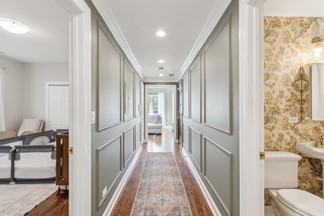 5140 N Albany Ave Unit 1, Chicago, IL 60625 - hall featuring dark wood-style floors, wallpapered walls, ornamental molding, and recessed lighting