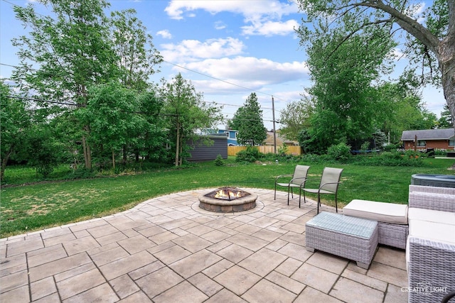 view of patio / terrace featuring an outdoor fire pit