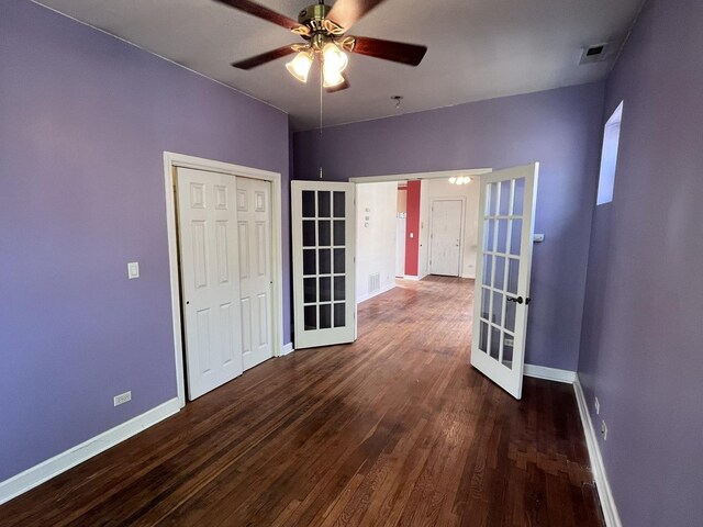 3353 W Wilson Ave Unit 3F, Chicago, IL 60625 - empty room featuring french doors, baseboards, and dark wood finished floors