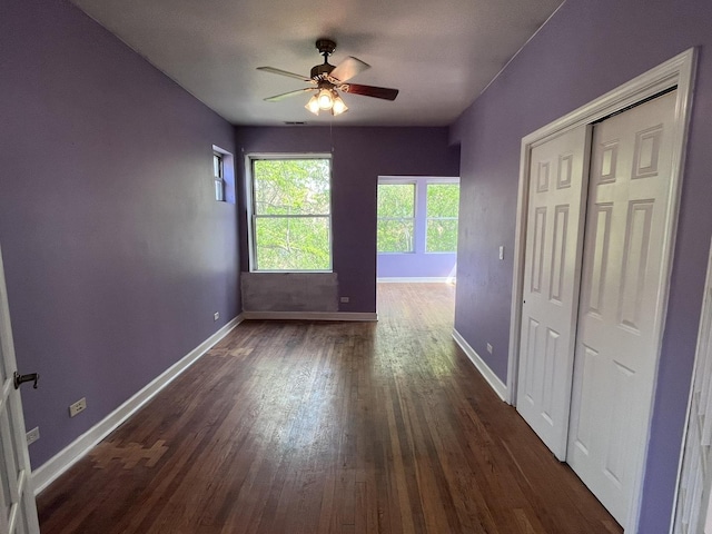 3353 W Wilson Ave Unit 3F, Chicago, IL 60625 - spare room featuring ceiling fan, baseboards, and dark wood-type flooring