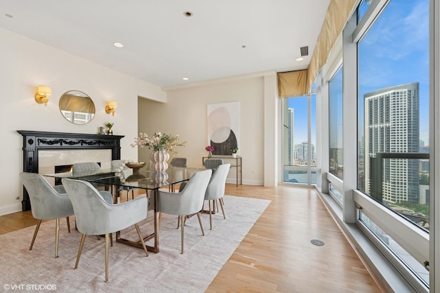 333 N Canal St Unit 2201, Chicago, IL 60606 - dining room featuring light wood-style floors, a view of city, and recessed lighting