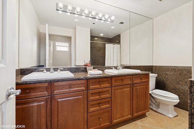 333 N Canal St Unit 2201, Chicago, IL 60606 - bathroom featuring tile patterned flooring, a shower with curtain, double vanity, and tile walls