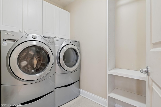 333 N Canal St Unit 2201, Chicago, IL 60606 - washroom with washing machine and clothes dryer, cabinet space, and light tile patterned floors