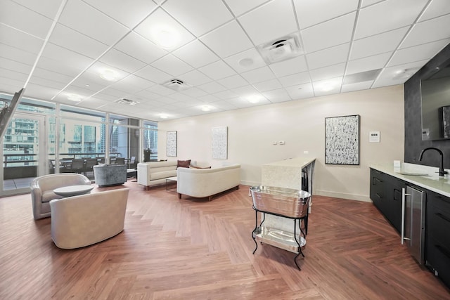 333 N Canal St Unit 2201, Chicago, IL 60606 - living room featuring healthy amount of natural light and a paneled ceiling