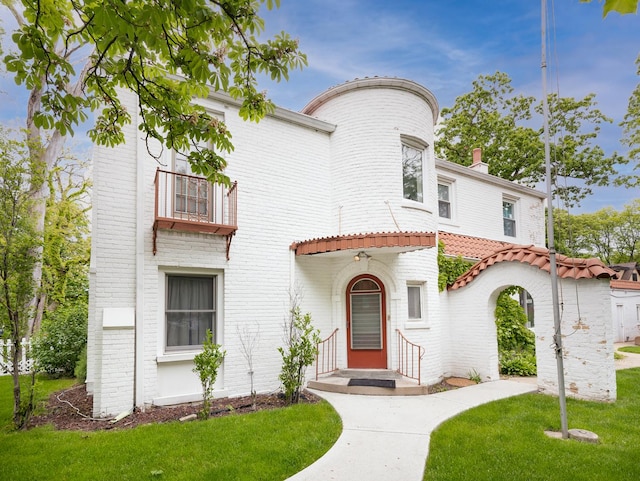 5803 N Kolmar Ave, Chicago, IL 60646 - view of front of home featuring a front lawn, brick siding, and a tiled roof