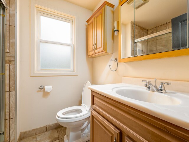 5803 N Kolmar Ave, Chicago, IL 60646 - bathroom featuring vanity, toilet, tiled shower, and baseboards