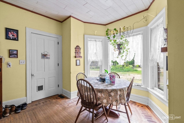 730 E Main St, Amboy, IL 61310 - dining room with crown molding, plenty of natural light, baseboards, and hardwood / wood-style floors