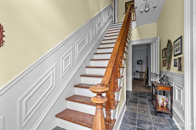 730 E Main St, Amboy, IL 61310 - staircase with stone finish floors and a chandelier