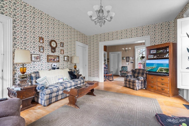 730 E Main St, Amboy, IL 61310 - living area with a chandelier, wallpapered walls, and wood finished floors