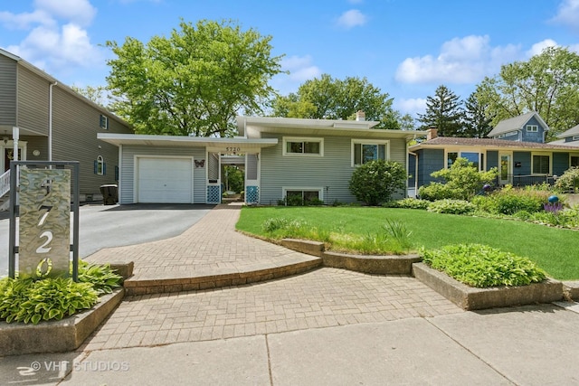 5720 Dunham Rd, Downers Grove, IL 60516 - tri-level home featuring driveway, a front lawn, and a garage