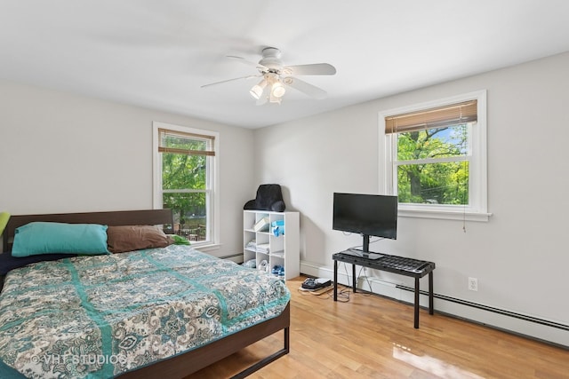 5720 Dunham Rd, Downers Grove, IL 60516 - bedroom featuring a baseboard radiator, wood finished floors, and ceiling fan