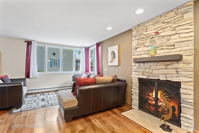 5720 Dunham Rd, Downers Grove, IL 60516 - living room with a baseboard heating unit, wood finished floors, and a stone fireplace