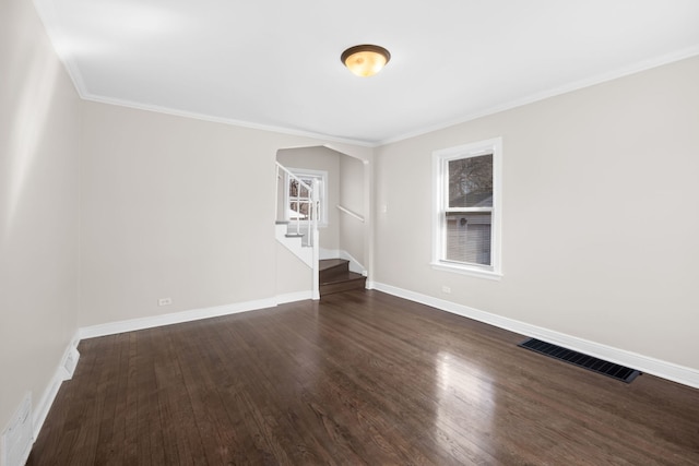 228 E 140th Pl, Dolton, IL 60419 - unfurnished room with stairway, dark wood-style floors, baseboards, and ornamental molding