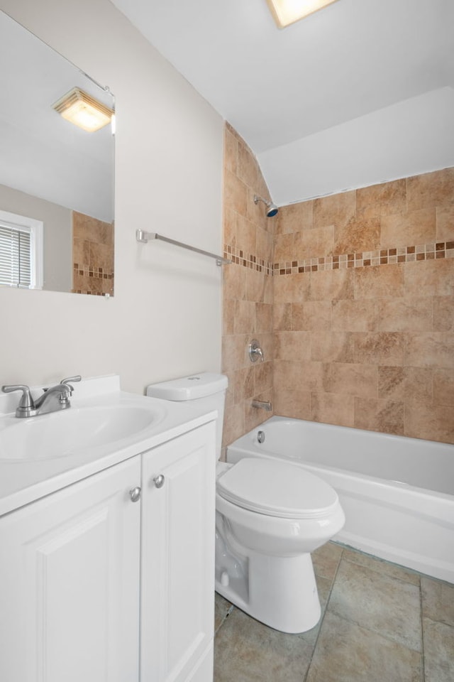 228 E 140th Pl, Dolton, IL 60419 - bathroom with tile patterned floors, shower / tub combination, toilet, vanity, and vaulted ceiling