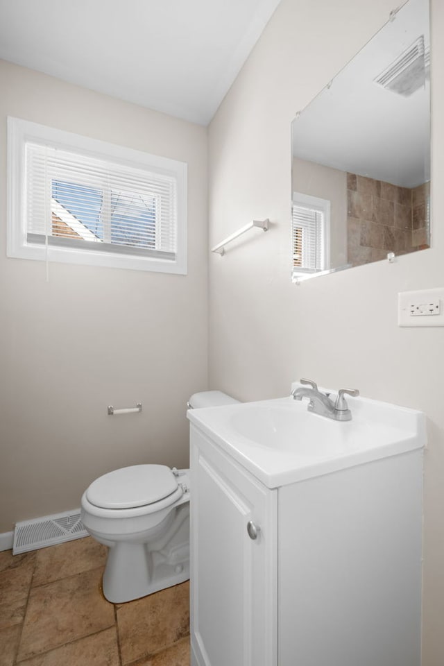 228 E 140th Pl, Dolton, IL 60419 - bathroom with vanity, toilet, and baseboards