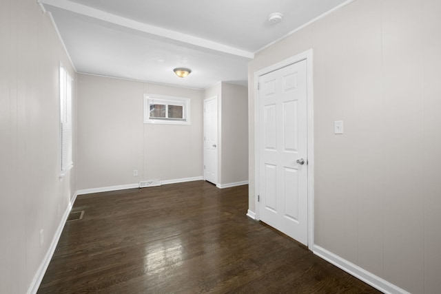 228 E 140th Pl, Dolton, IL 60419 - spare room featuring dark wood-type flooring, healthy amount of natural light, baseboards, and ornamental molding