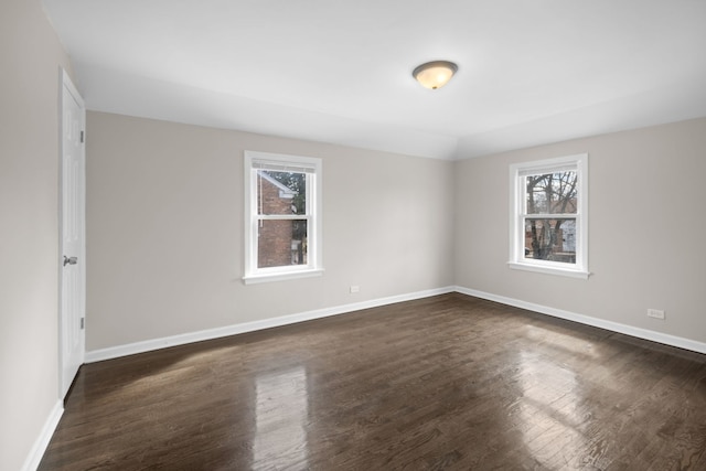 228 E 140th Pl, Dolton, IL 60419 - unfurnished room featuring plenty of natural light, dark wood finished floors, and baseboards