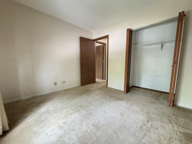 1219 Williamsport Dr Unit 28-3, Westmont, IL 60559 - unfurnished bedroom featuring carpet flooring, a closet, and baseboards