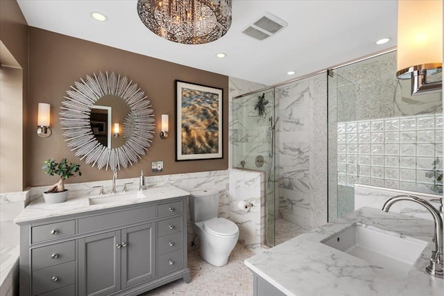 1162 W Farwell Ave, Chicago, IL 60626 - bathroom with tile walls, a marble finish shower, vanity, recessed lighting, and toilet
